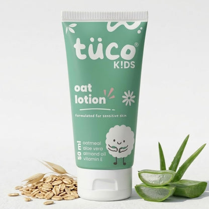 Tube of tüco Kids oat lotion with oats and aloe vera on a white background