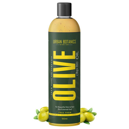 Bottle of Urban Botanics olive oil with green leaves on a white background