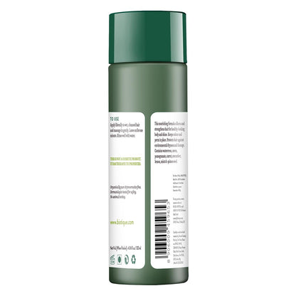Green bottle with label on a white background