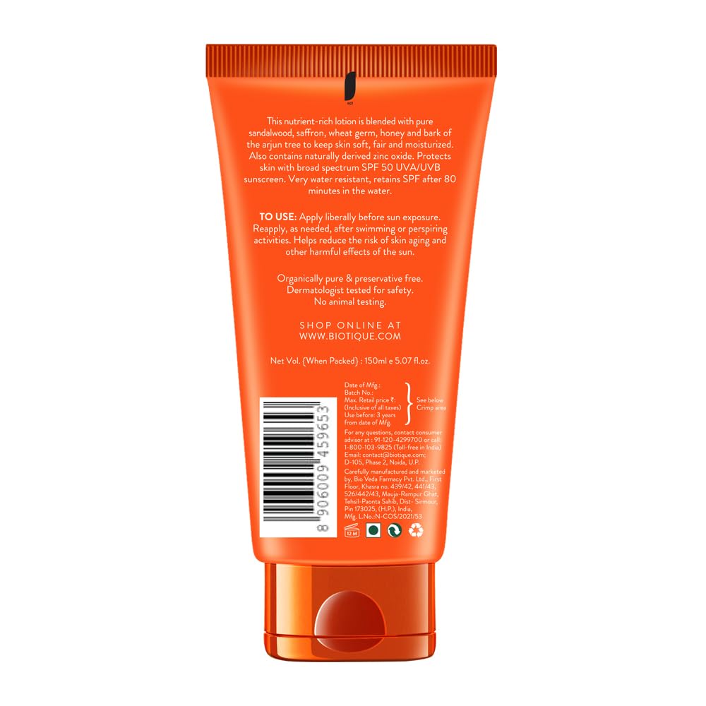 Back view of an orange skincare product tube with text and a barcode on a white background