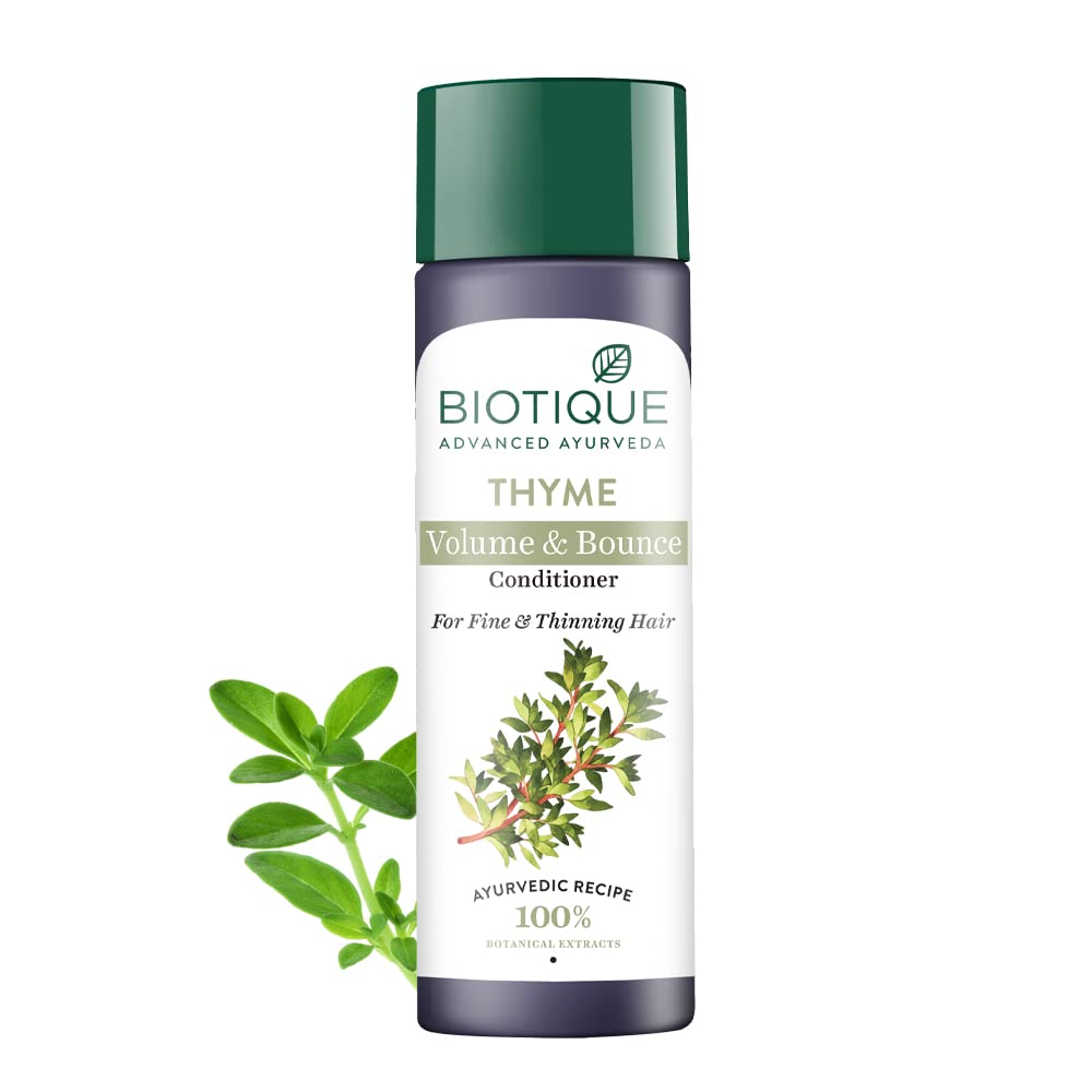 Biotique Thyme Volume & Bounce Conditioner bottle with green leaves on a white background