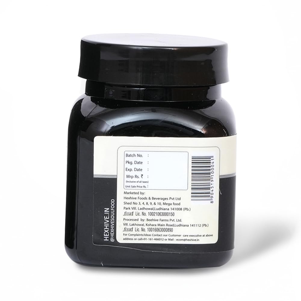 Black jar with a label on a white background