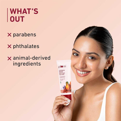 Woman holding a skincare product with 'What's Out' text on a pink background