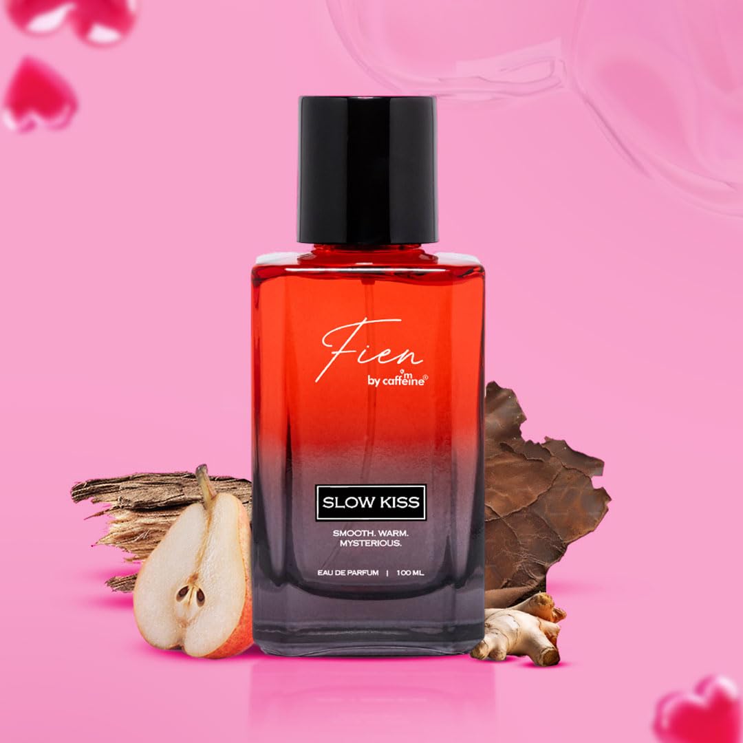 Perfume bottle labeled 'Slow Kiss' by Fien on a pink background with heart shapes.