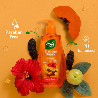 Nyle Damage Repair shampoo bottle with natural ingredients on an orange background