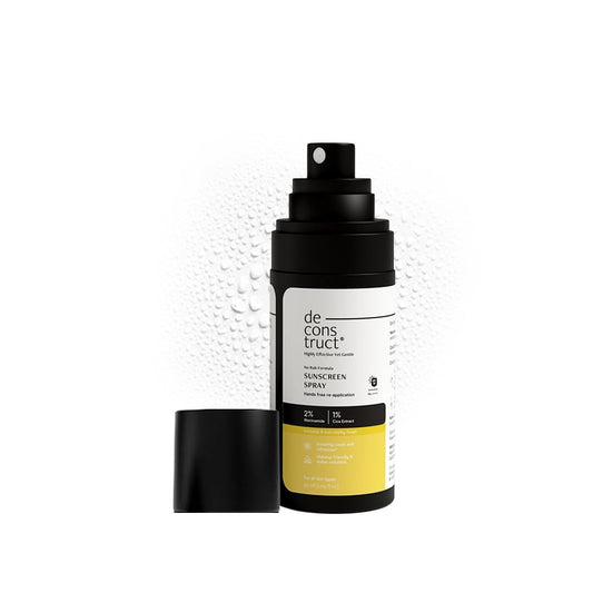 Sunscreen spray bottle with 'de construct' branding on a white background