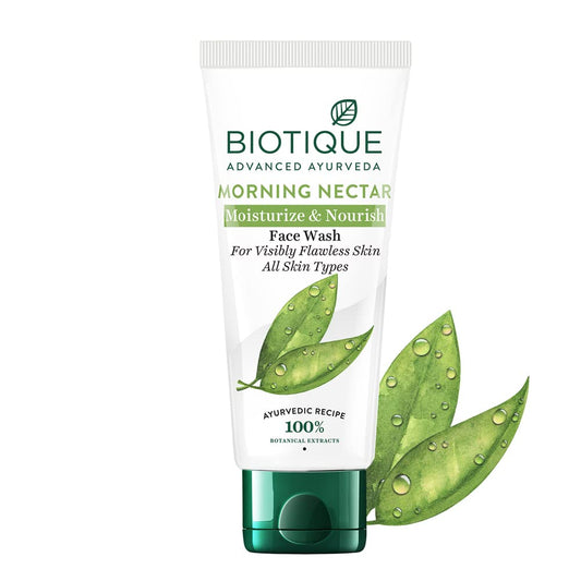 Biotique Morning Nectar Face Wash tube with green leaves on a white background