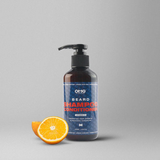 Bottle of OTCG Beard Shampoo Conditioner with an orange on a gray background