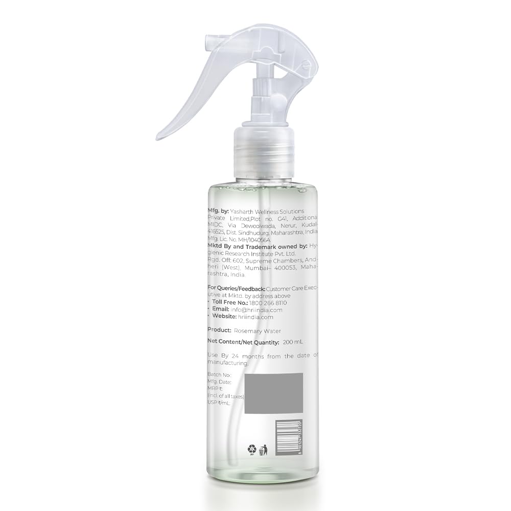 Clear spray bottle with a white label on a white background
