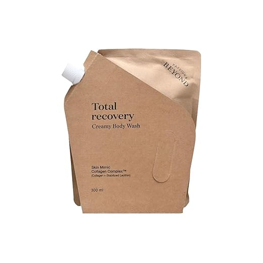 Brown packaging of Total Recovery Creamy Body Wash with a white pump on a white background
