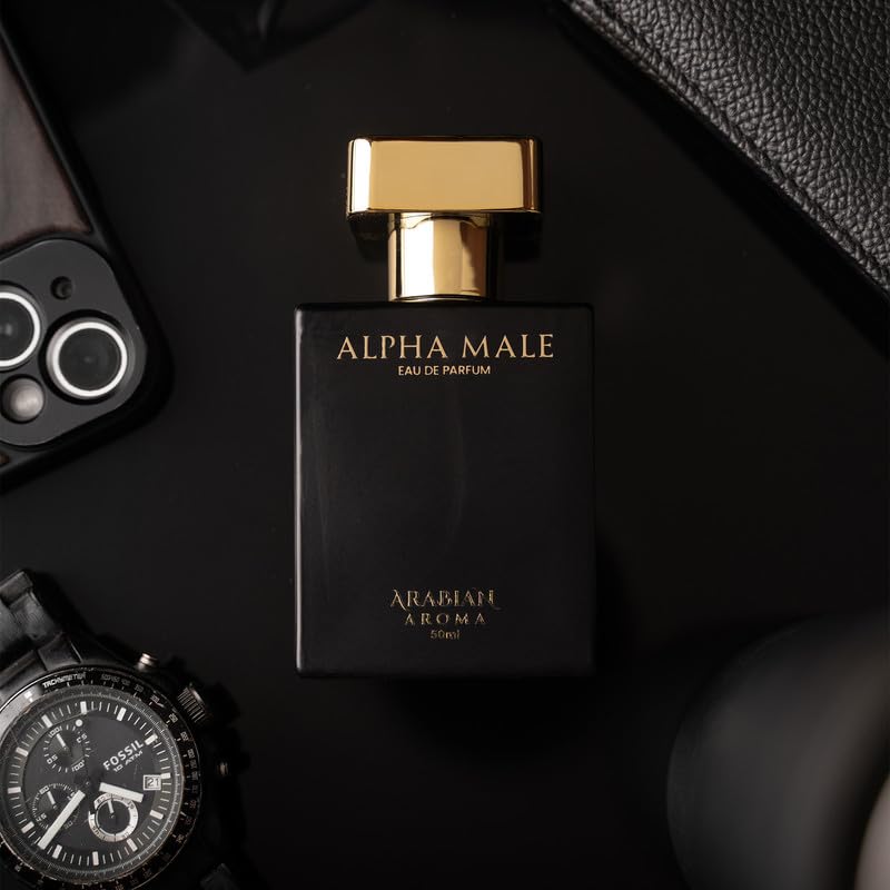 Black and gold perfume bottle labeled 'Alpha Male' on a dark surface with accessories.