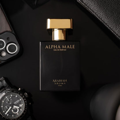 Black and gold perfume bottle labeled 'Alpha Male' on a dark surface with accessories.