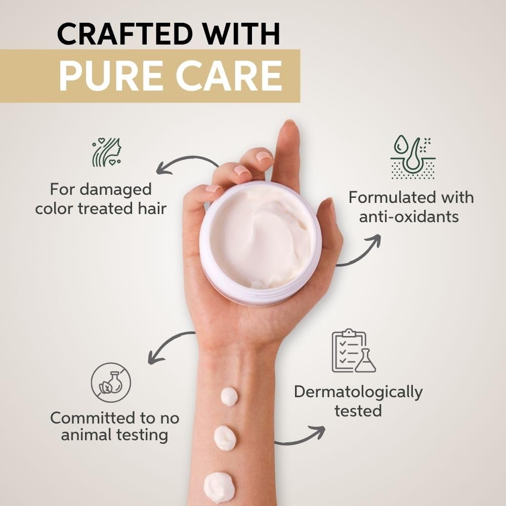 Hand holding a container of cream with text about product features on a light background