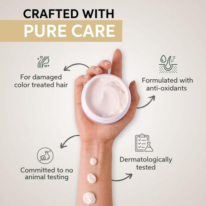 Hand holding a container of cream with text about product features on a light background