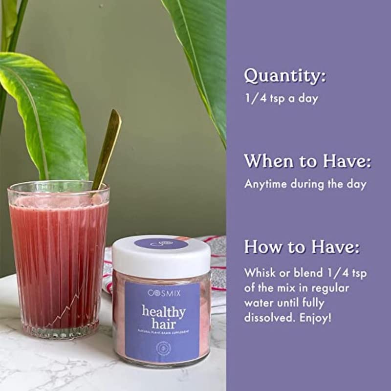 Cosmix healthy hair product with a glass of red juice and plant in the background