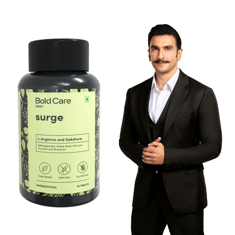 Man in a suit standing next to a bottle labeled 'Bold Care Daily Surge' on a white background