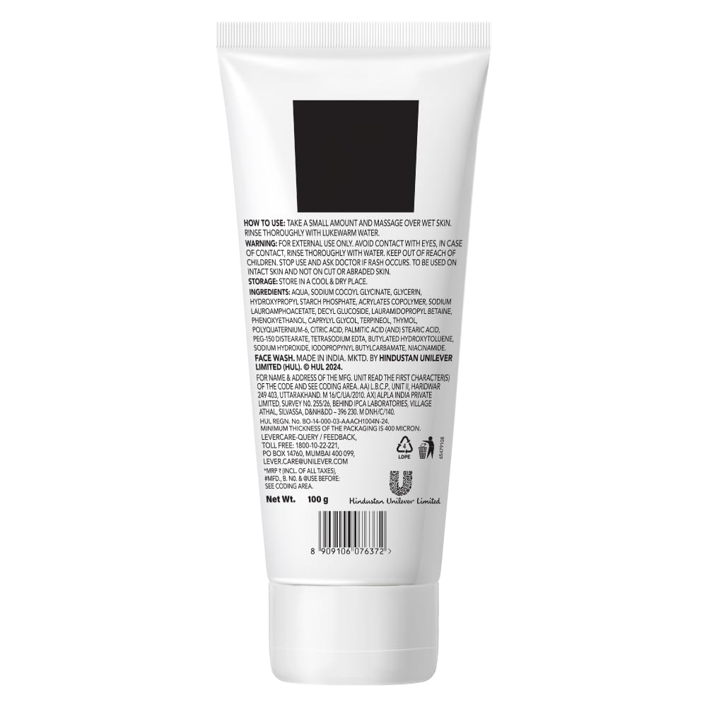 White tube of face wash with black label on a white background