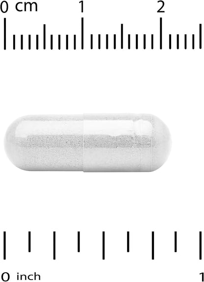 White capsule pill with a ruler for scale on a white background