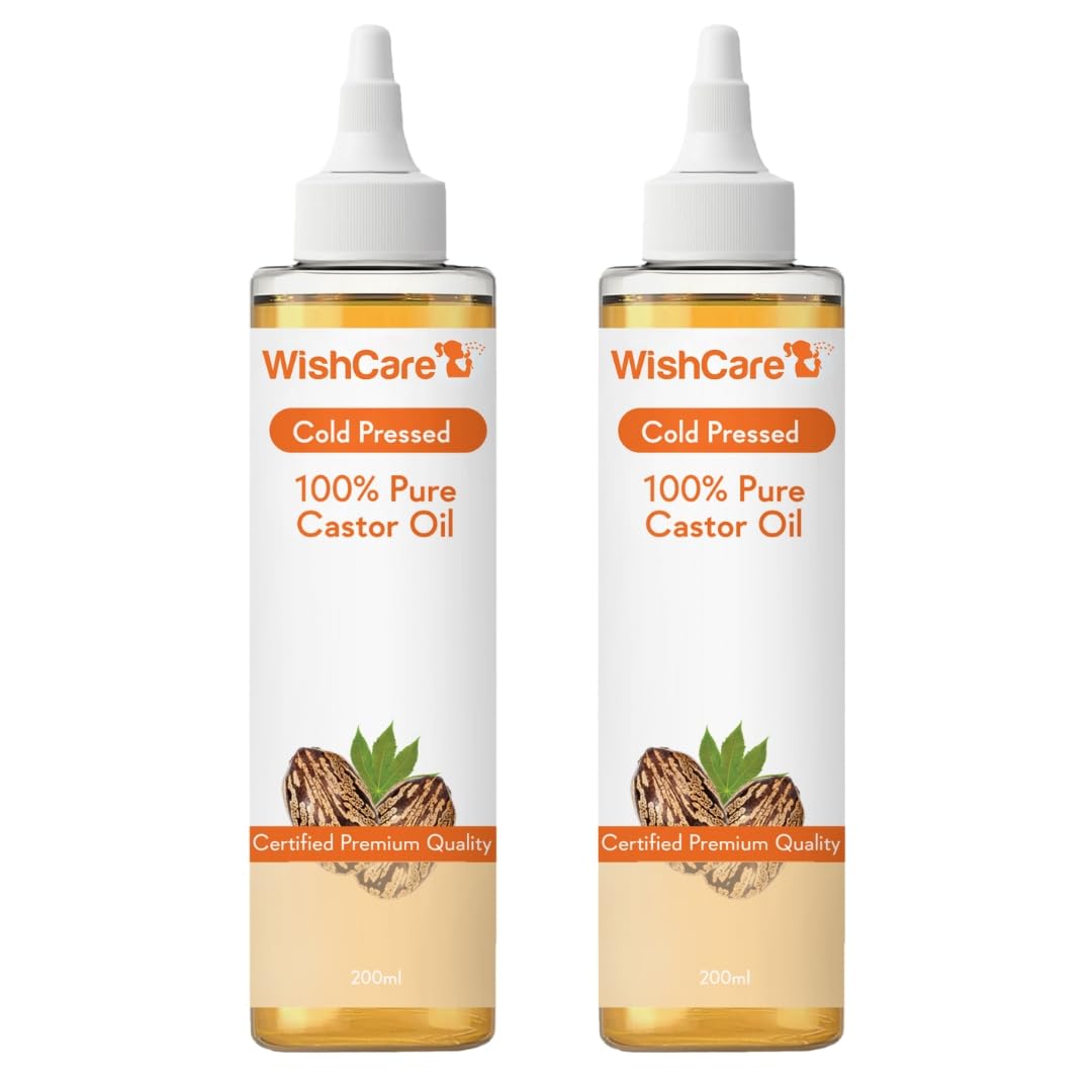 Two bottles of WishCare 100% Pure Castor Oil on a white background