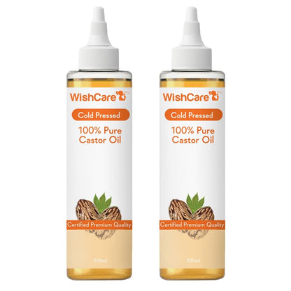 Two bottles of WishCare 100% Pure Castor Oil on a white background