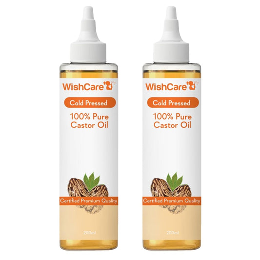 Two bottles of WishCare 100% Pure Castor Oil on a white background
