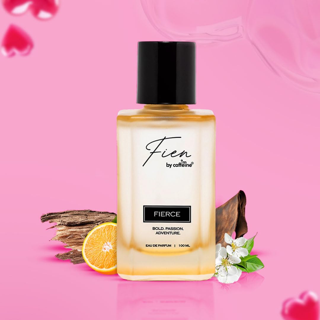 Fierce perfume bottle with floral and wooden elements on a pink background