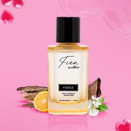 Fierce perfume bottle with floral and wooden elements on a pink background