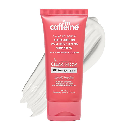 Pink sunscreen tube with white cap on a white background