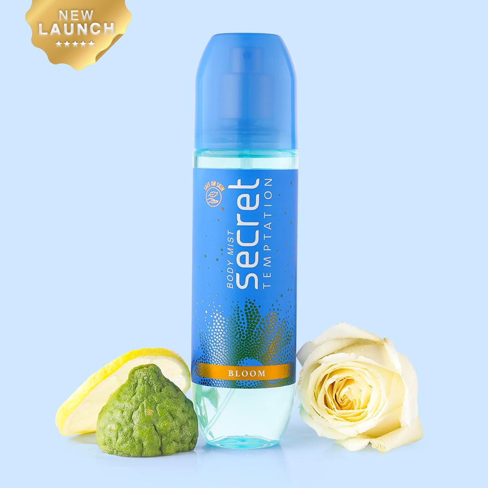 Secret deodorant spray bottle with lemon, green fruit, and rose on a light blue background
