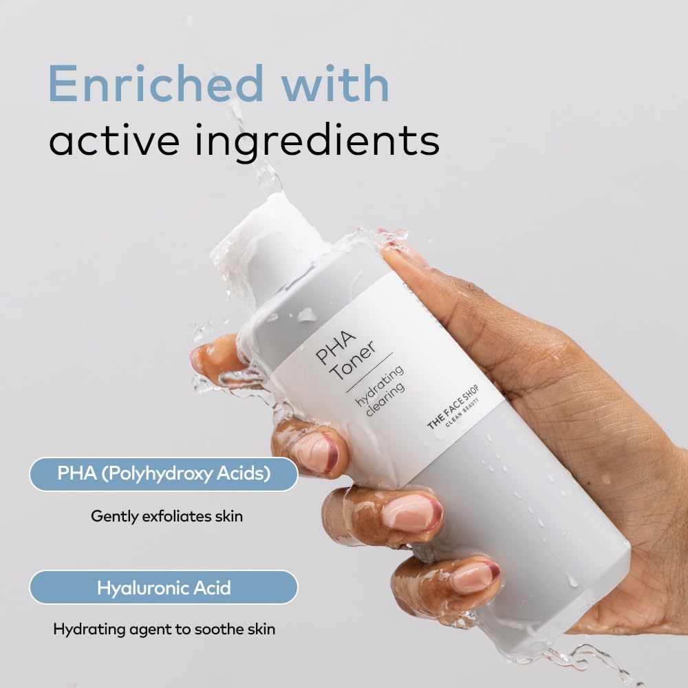 Hand holding a PHA Toner bottle with text about active ingredients on a gray background