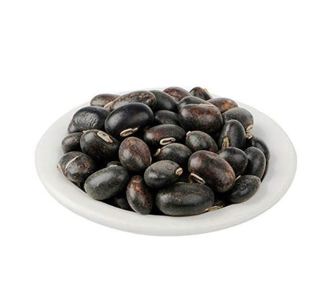 White bowl filled with black beans on a white background