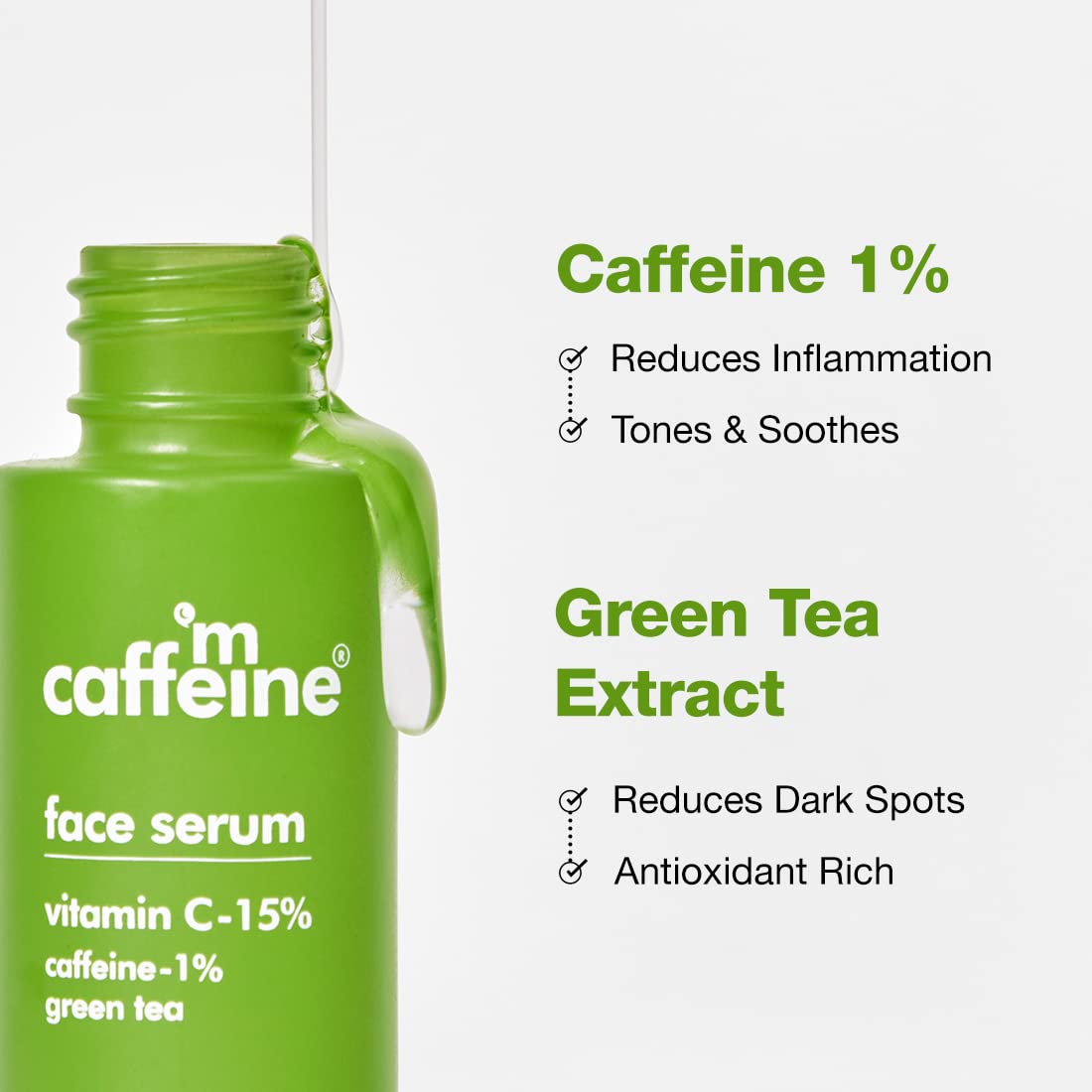 Green face serum bottle with text highlighting caffeine, green tea extract, and vitamin C content on a white background.