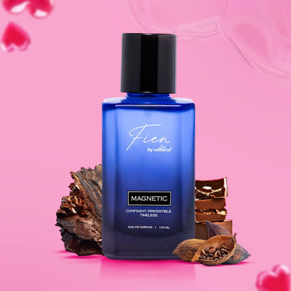 Blue perfume bottle with black cap on a pink background