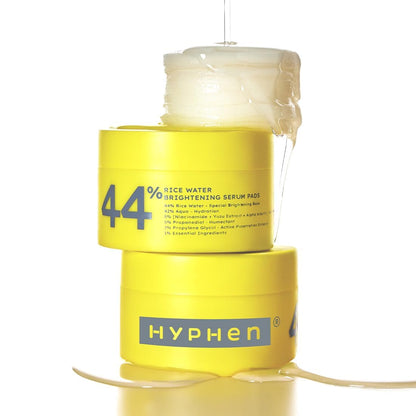Yellow container of Hyphen 44% Rice Water Brightening Serum Pads on a white background