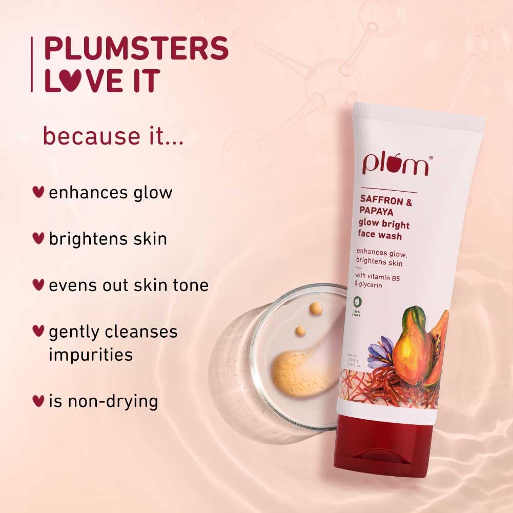 Plum brand face wash tube with benefits listed on a pink background