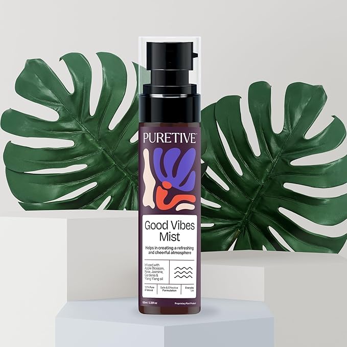 PURETIVE Good Vibes Mist bottle with decorative leaves in the background