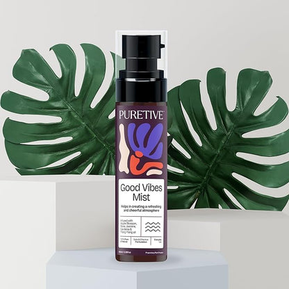 PURETIVE Good Vibes Mist bottle with decorative leaves in the background