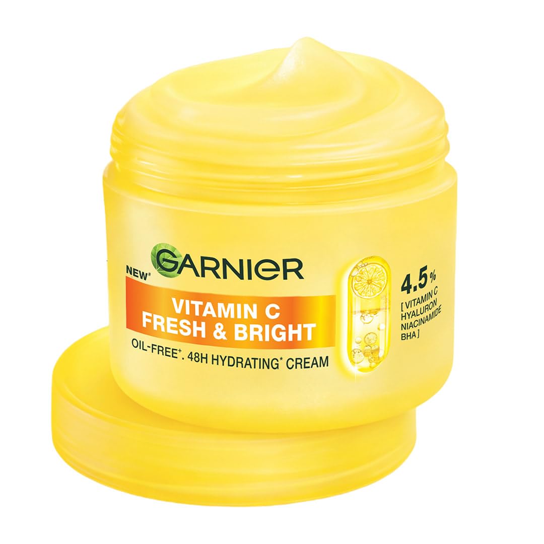 Yellow jar of Garnier Vitamin C Fresh & Bright cream on a white background
