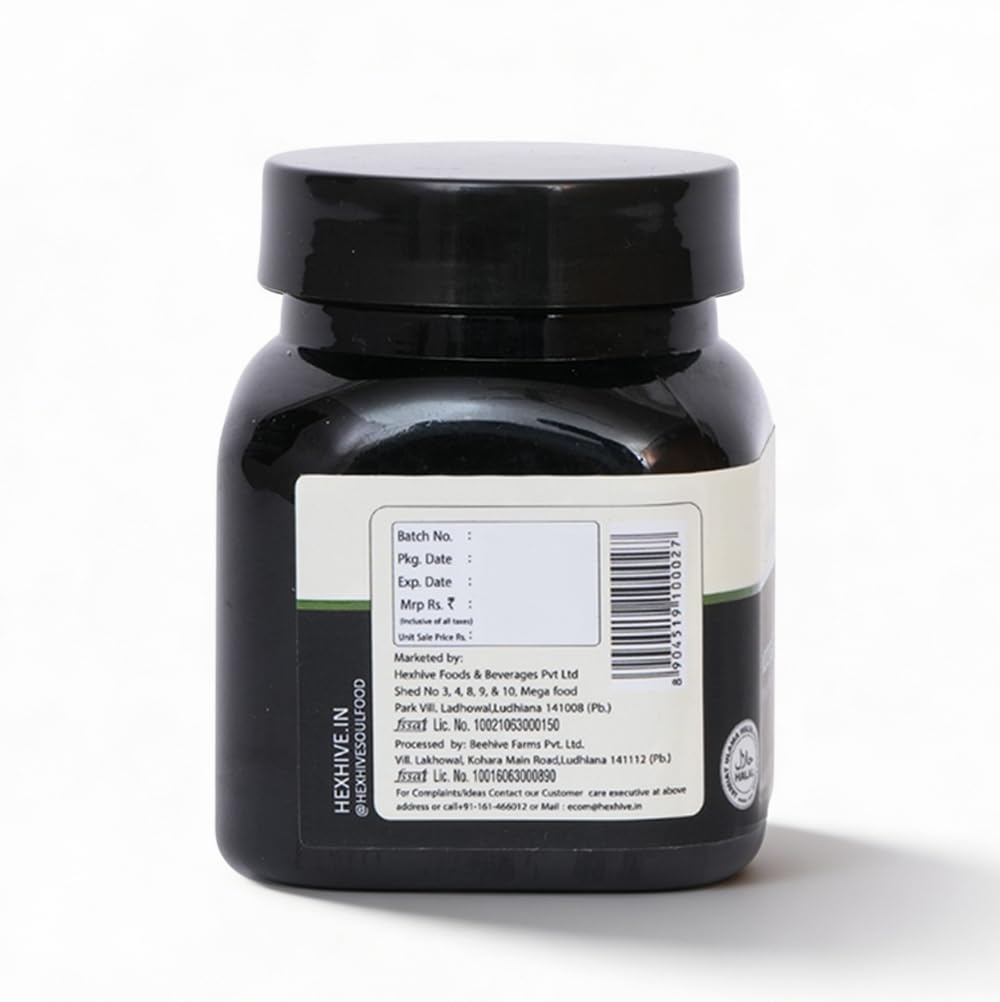 Black jar with a label on a white background