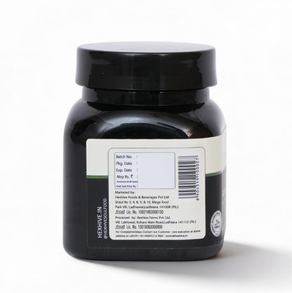 Black jar with a label on a white background
