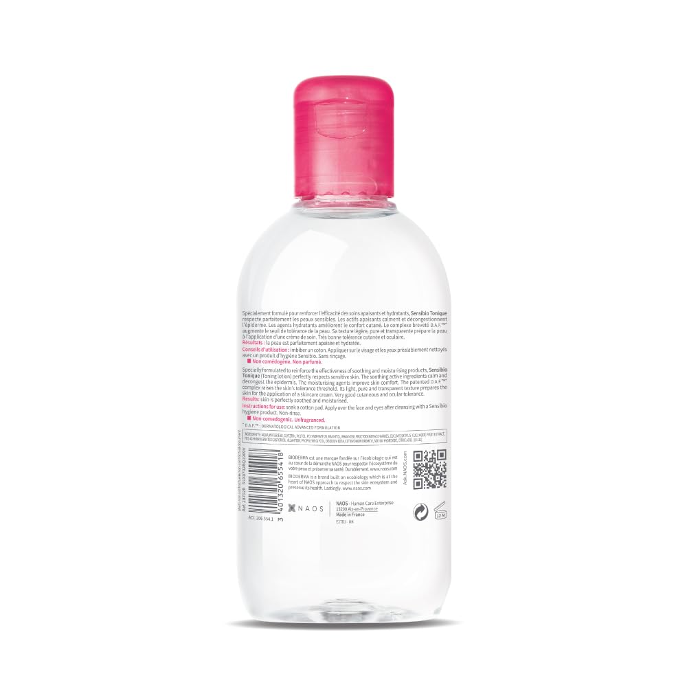 Clear bottle with pink cap on a white background