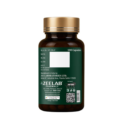 Bottle of capsules with a green label and gold cap on a white background