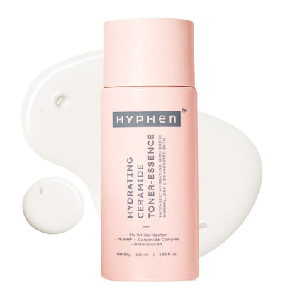 Pink bottle of Hyphen toner with a white applicator on a white background