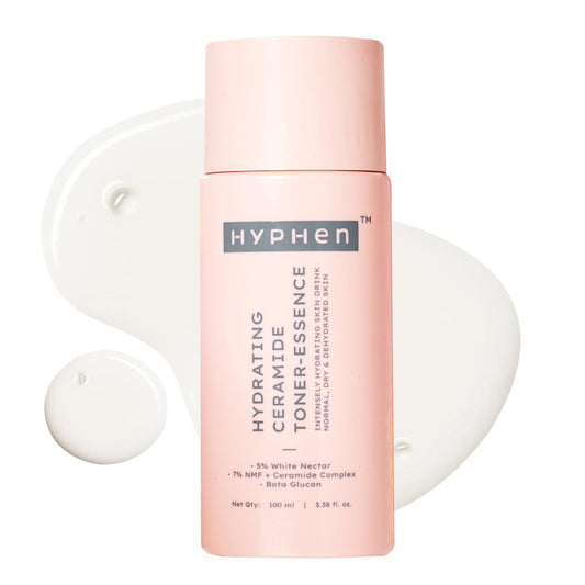 Pink bottle of Hyphen toner with a white applicator on a white background
