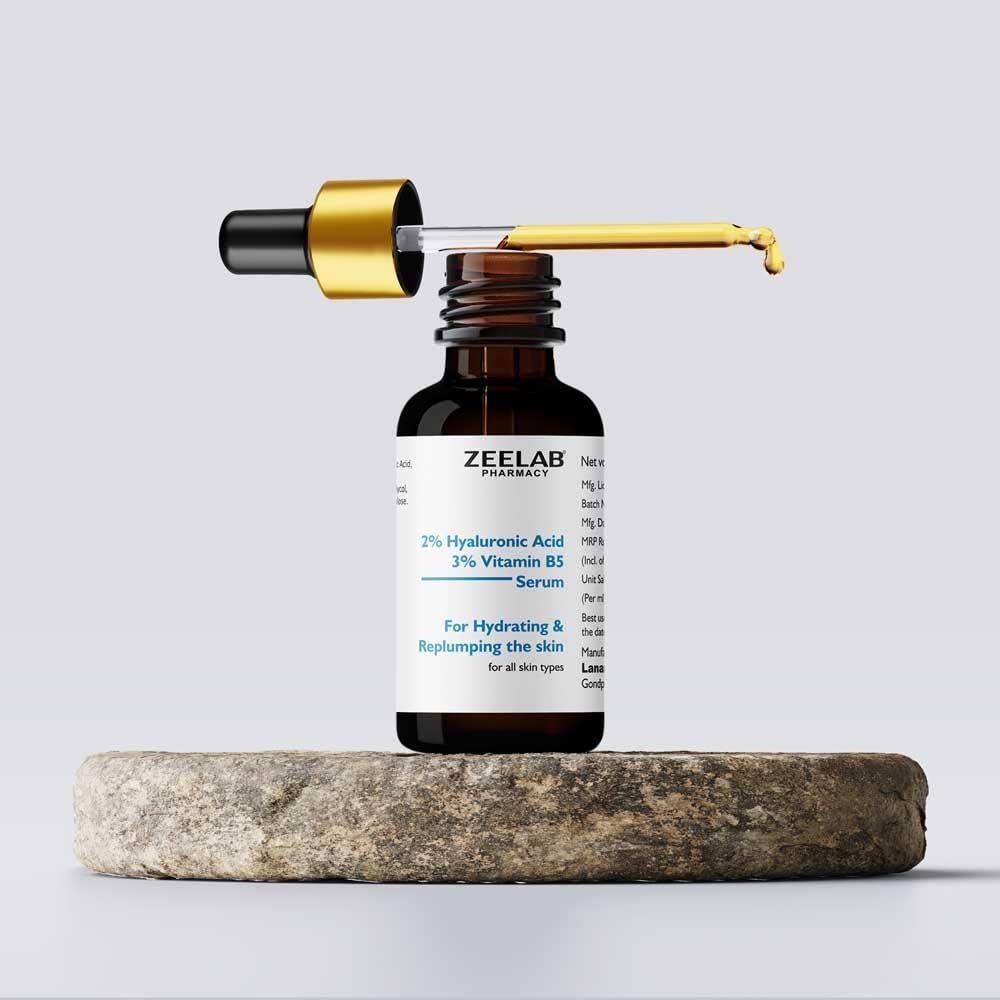Zeelab skincare serum bottle with dropper on a stone surface against a light gray background