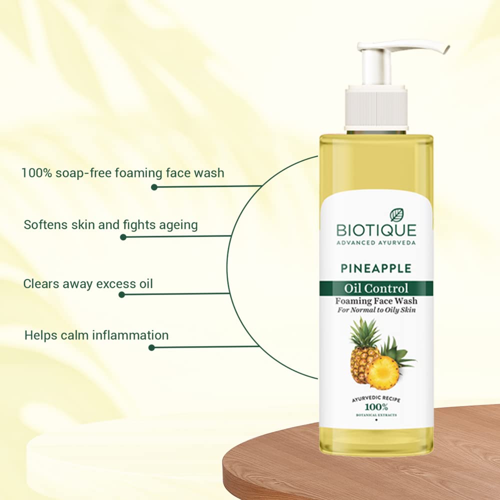 Biotique Pineapple Oil Control Foaming Face Wash bottle with features listed on a light yellow background