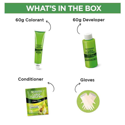 Garnier Color Naturals hair color kit with colorant, developer, conditioner, and gloves on a white background.