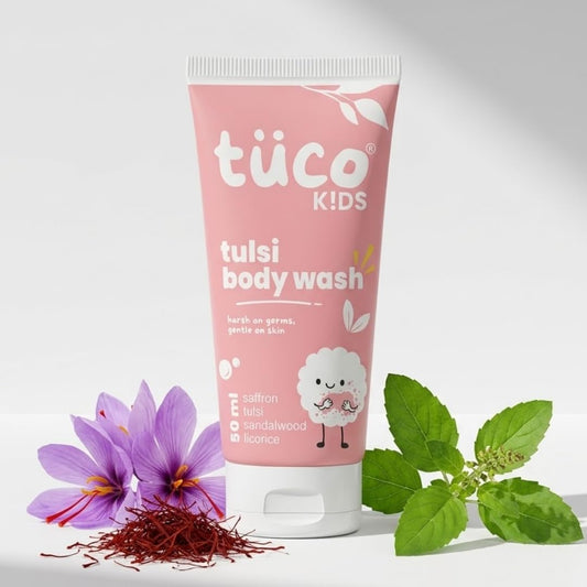 Tüsco Kids tulsi body wash tube with tulsi leaves and flowers on a white background
