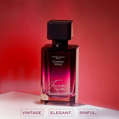 Perfume bottle labeled 'Cherry Wine' by Fien on a red background