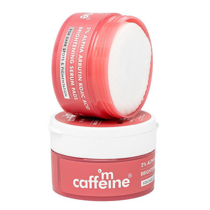 Two pink and white containers of caffeine skincare product on a white background